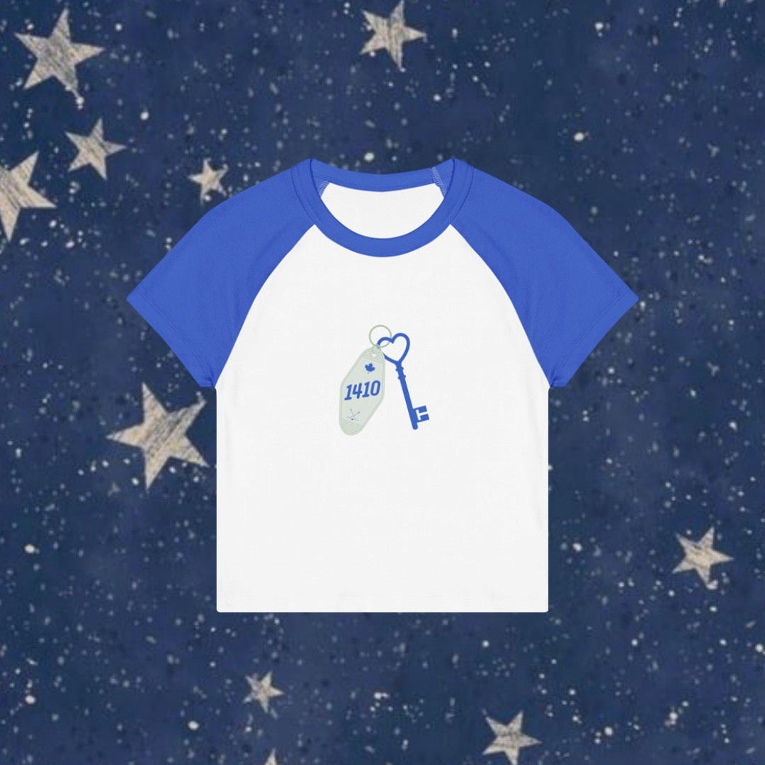 White t-shirt with blue sleeves on a navy background with stars