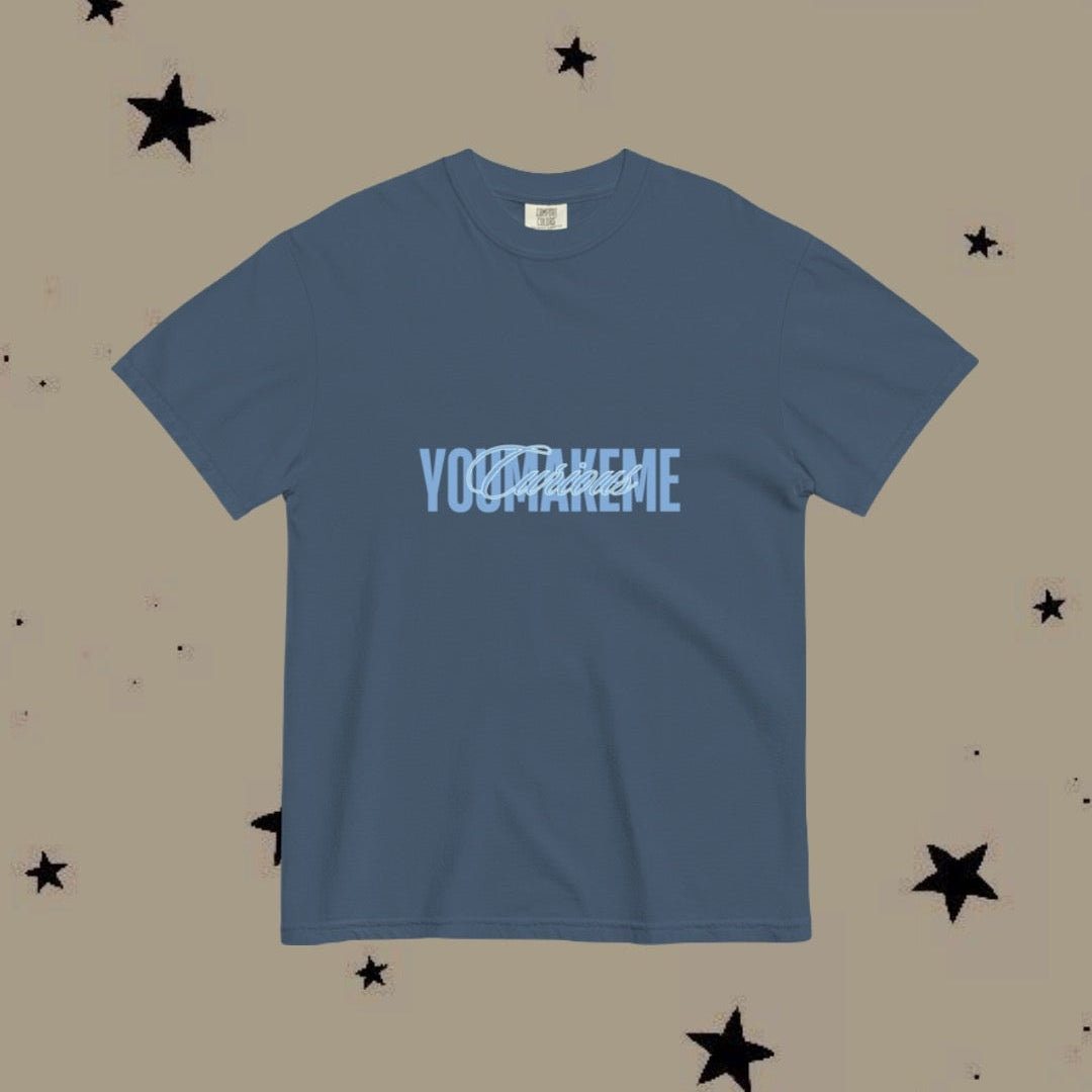 Blue t-shirt with text on a beige background with star patterns