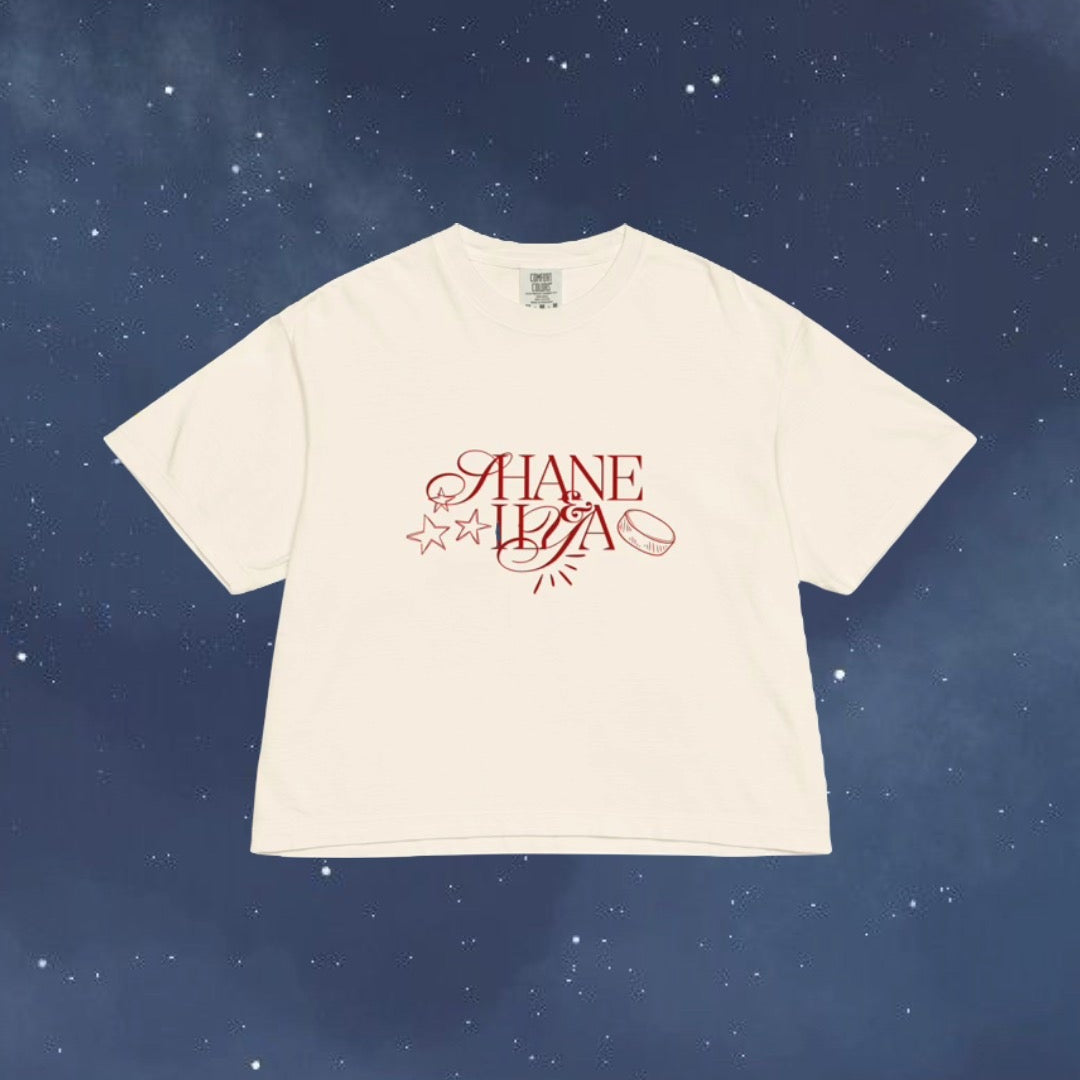 White t-shirt with red text on a blue starry background