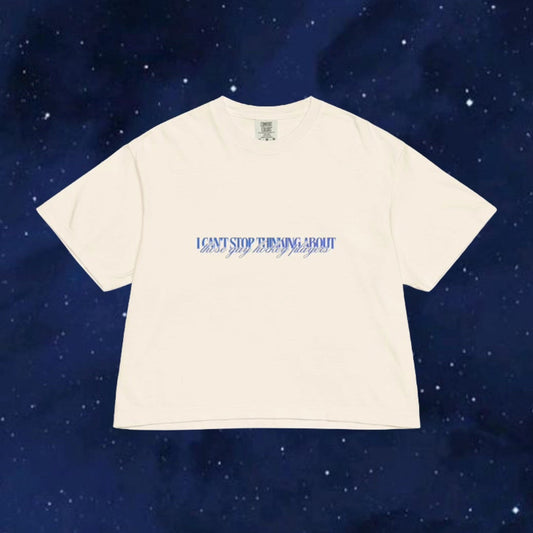 Beige t-shirt with text on a dark blue starry background